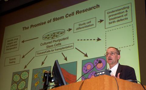 Dr. Battey speaking at the podium.