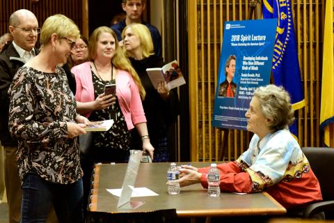Grandin signs books/