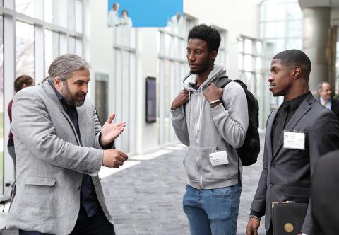 Smith interacts with students following his talk.