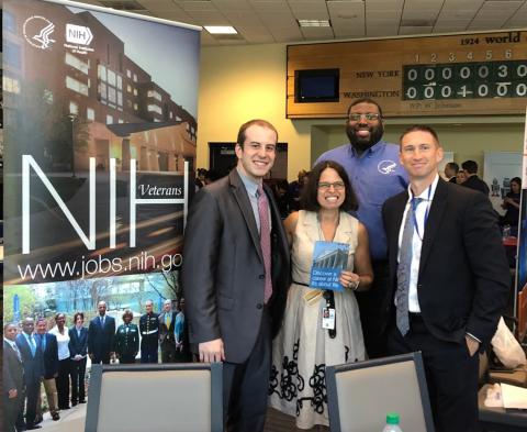 Gilman smiles along with three members of recruitment team