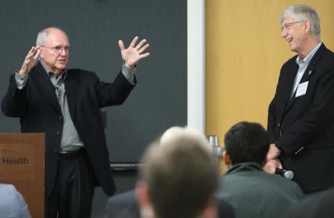 Craig Mundie speaks at the workshop as Dr. Collins looks on.