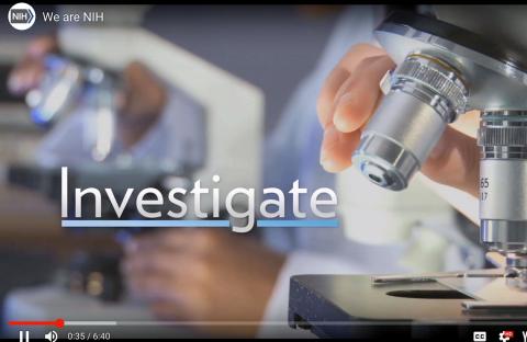 A screenshot from the NIH welcome video shows the word "investigate" next to a hand hovering over a microscope.