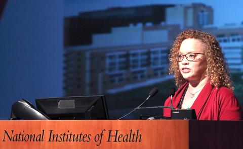 Debra Chew talks at podium