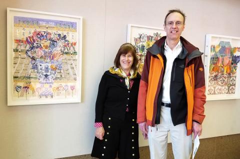 Foer and Levin stand in front of Foer's artwork