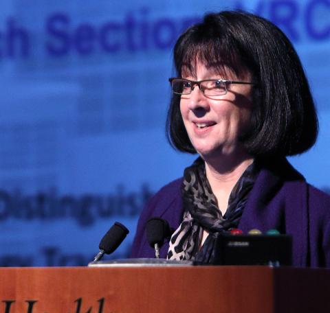 Dr. Nancy Sullivan talks from the podium