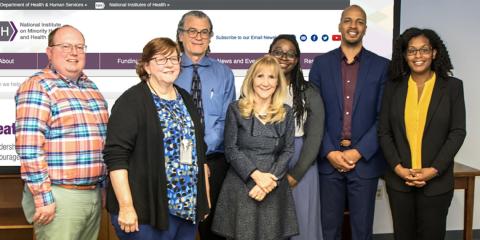 Visiting scholars from Fordham University meet with Dr. Perez-Stable.