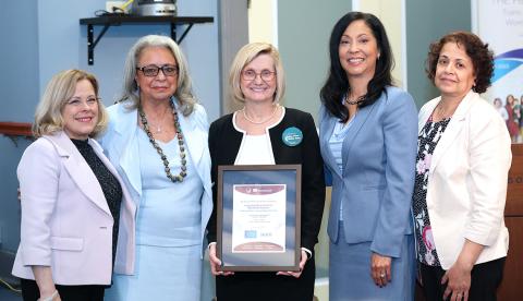 Five participants in the Pinn symposium pose for a photo.