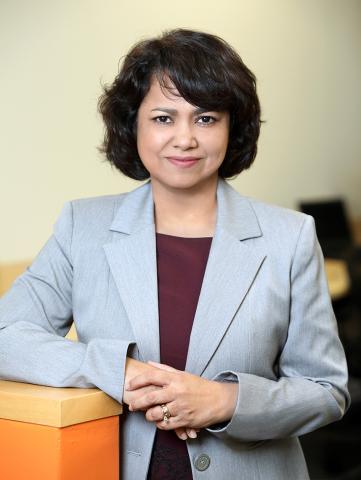 Byrnes stands with an elbow on counter.