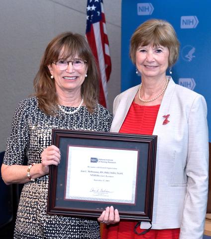 Cashion presents certificate to McSweeney 