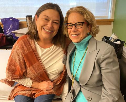 Murphy and Bianchi sit together smiling.
