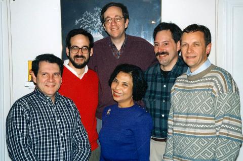 Group of people smiling into camera