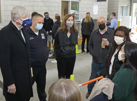Dr. Collins, assistant fire chief Mike Gilroy and ORS director Colleen McGowan thank staff.