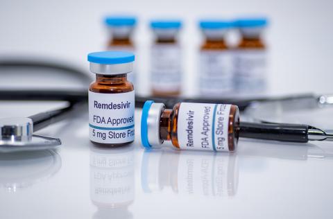 Vials of remdesivir sit on a counter next to a stethoscope.