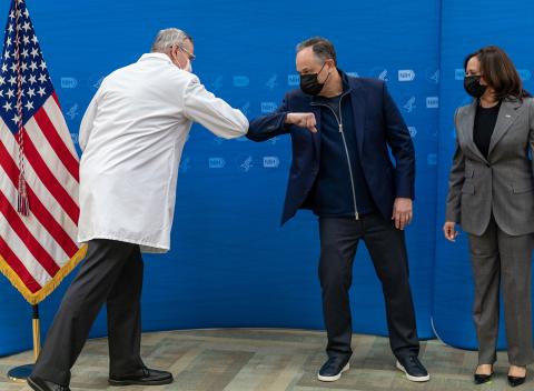 Graham and Emhoff bump elbows