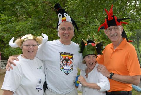 Kathy Russell, Chanock, Diane Baker and Dr. Collins all wearing festive hats at Camp Fantastic event