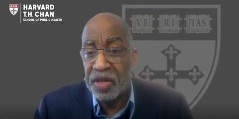 Williams speaks in front of a Zoom background