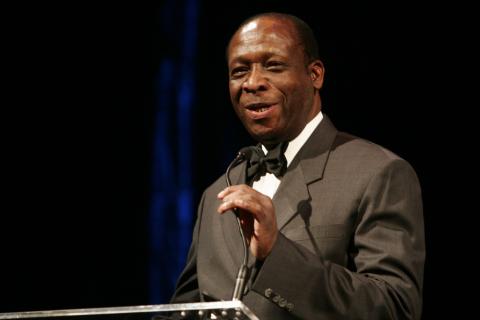 Dr. Agodoa speaks at a podium