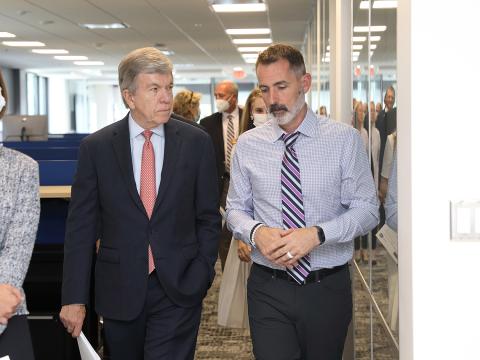 Blunt listens to Singleton speak about the CARD