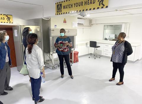 A group of researchers tour the biorepository.