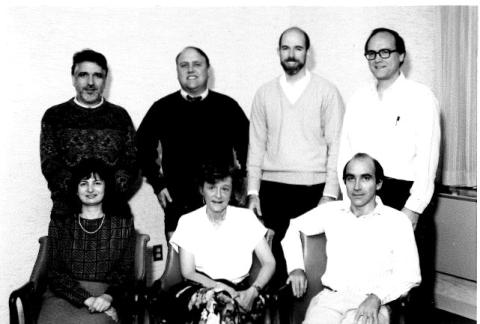 A black-and-white photo of Nisula with members of his branch, some seated, some standing