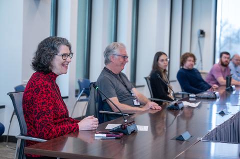 Ribaudo and Cross sit as a conference table