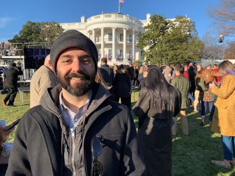 Rodriquez stands smiling on the south lawn of the White House