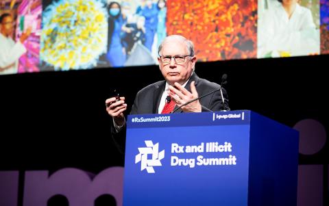 Dr. Lawrence Tabak at summit podium