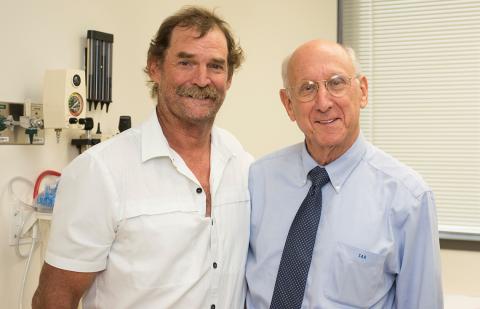 Rosenberg poses with smiling male patient