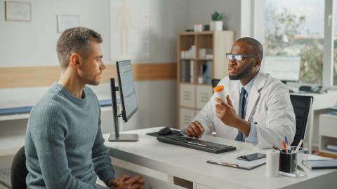 A doctor explains a medication to their patient.