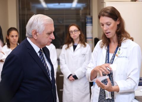 Heske shows Reed a well plate