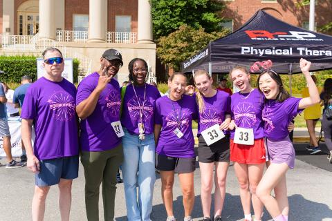 The purple-clad Eosinothrills team pose for a group photo.
