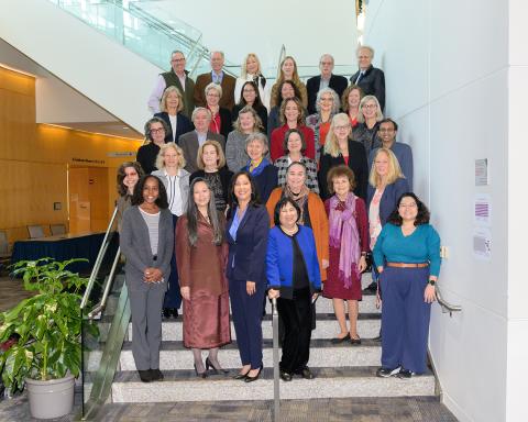 BIRCWH attendees pose for a photo, filling up a flight of stairs all the way to the first landing.