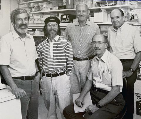 A black-and-white photo of Felsenfeld and four other colleagues.