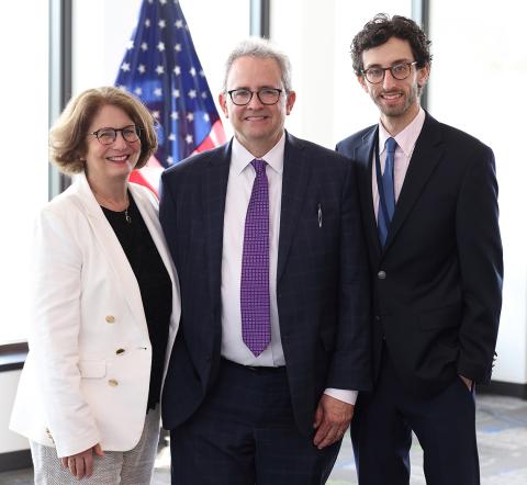 Burklow, center, with wife and son at meeting room in Natcher