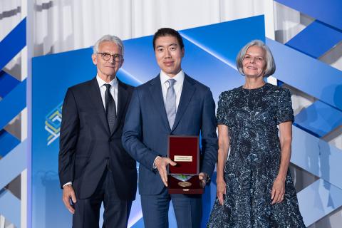 Past awardee poses with FNIH staff