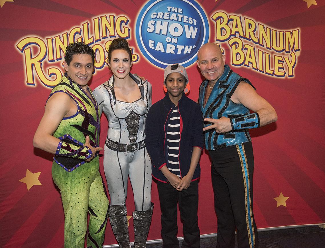 Circus performers pose with patient.