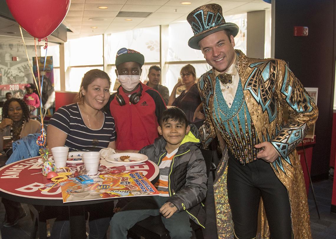 Circus ringmaster meets patient and parent.