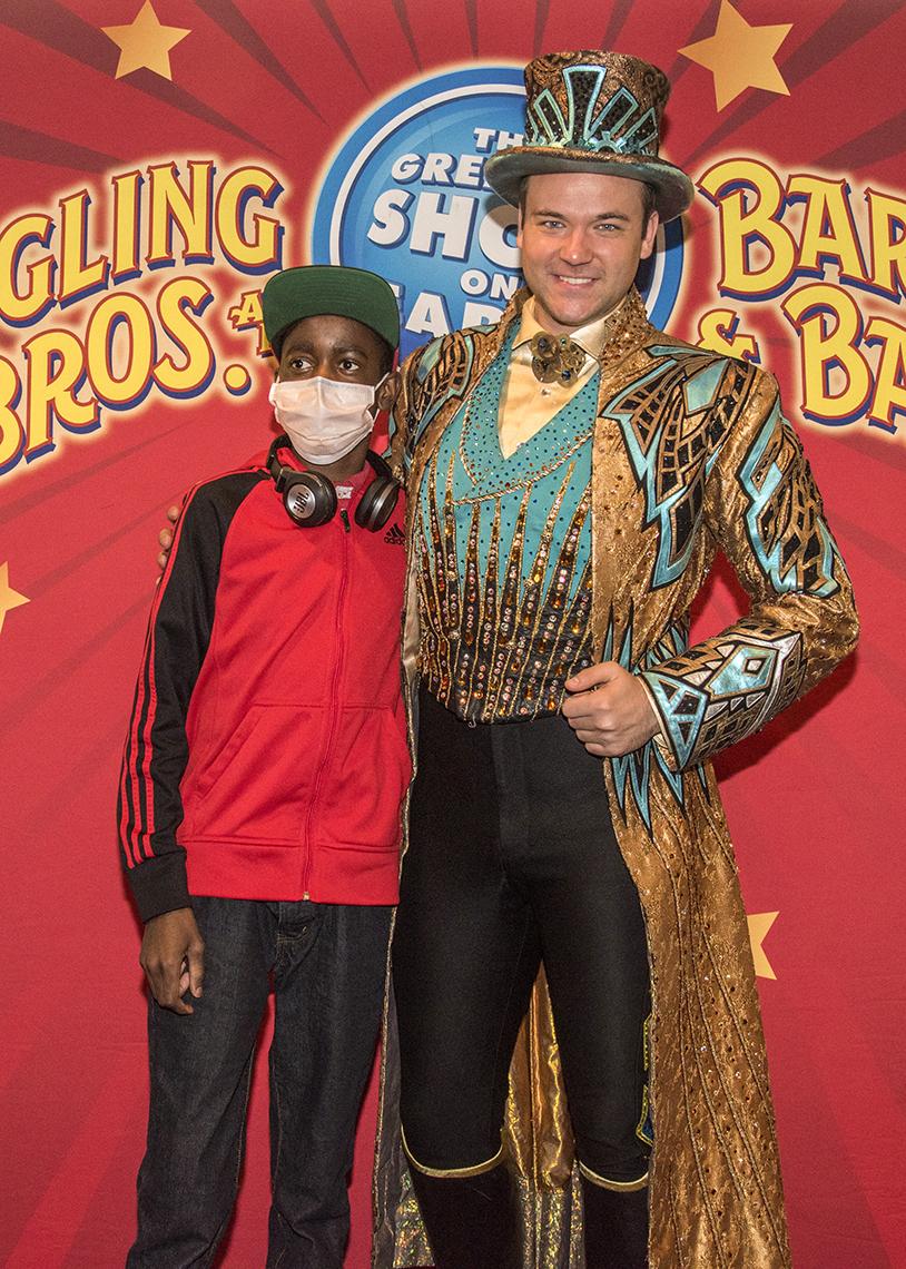 Young patient is greeted by ringmaster.