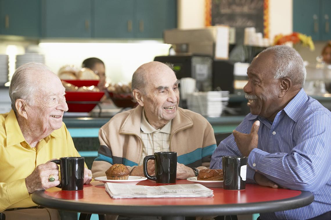 Older people sharing coffee