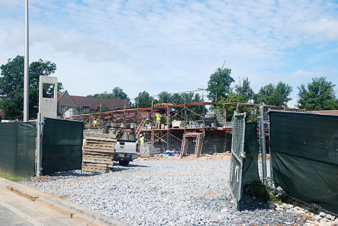 Entrance to construction site with fence gate open