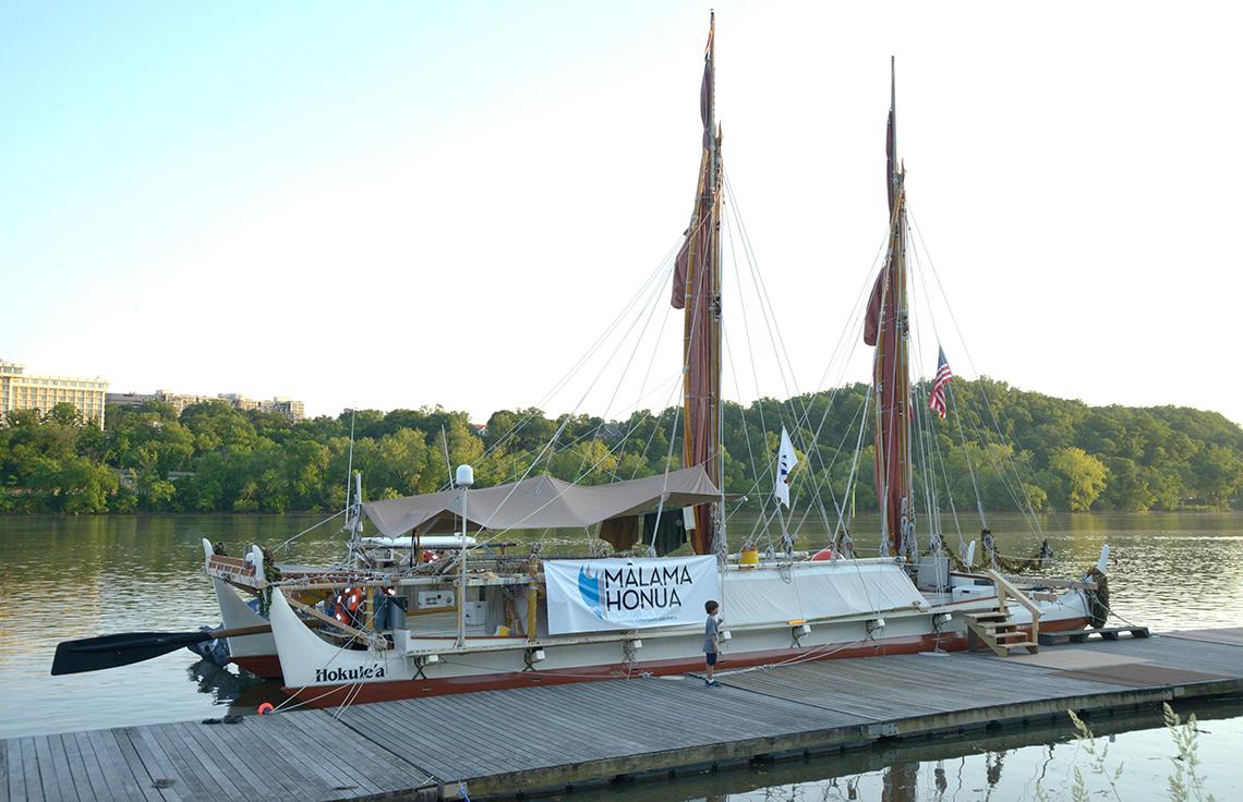 The voyaging canoe tied up at the dock in Georgetown