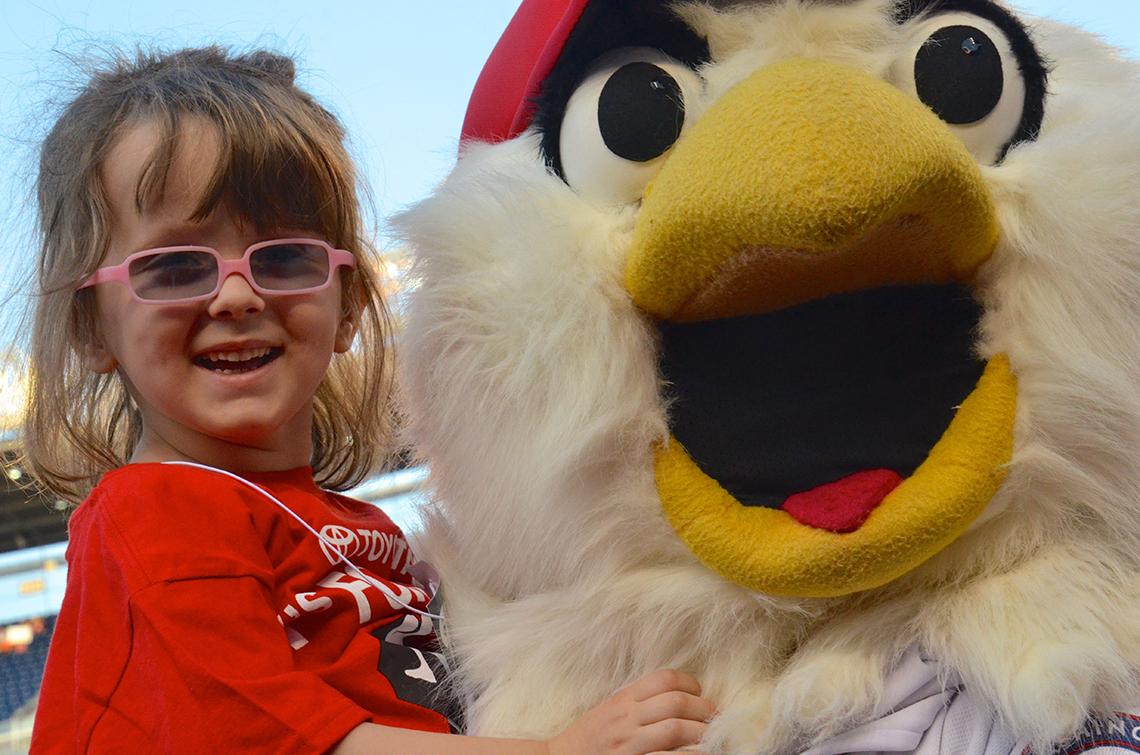 Child with team mascot