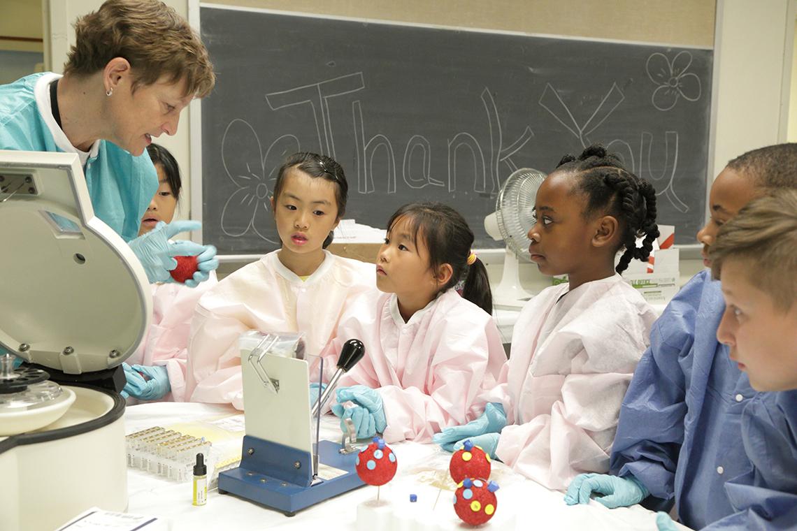 Byrne speaks to three children