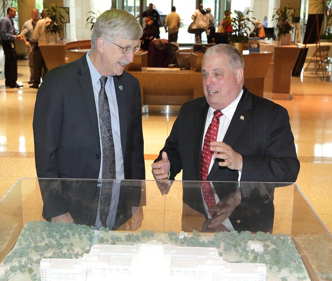 Collins and Hogan stand chatting in CRC atrium.