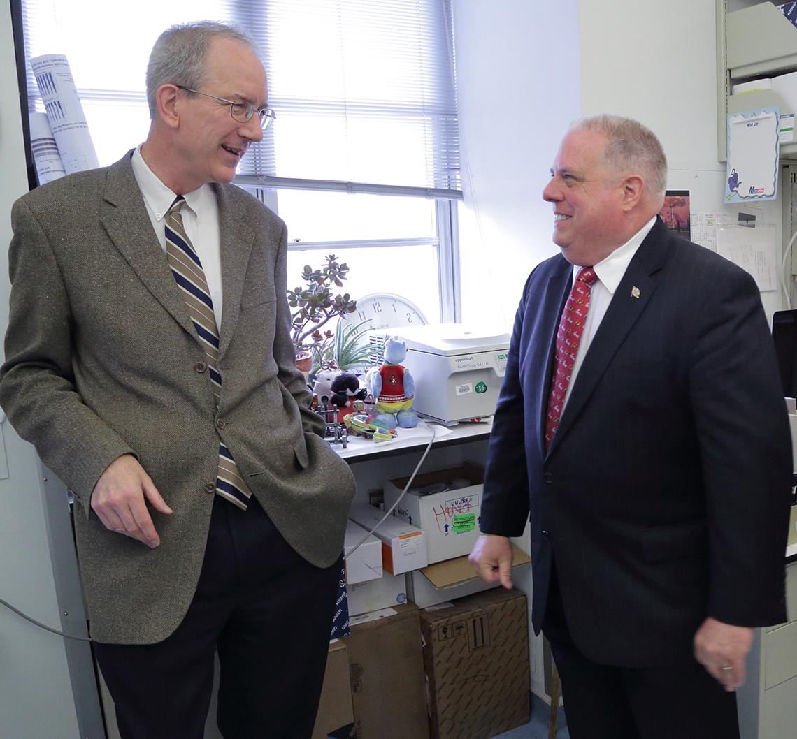 Hogan and Dr. Staudt chat in his lab.