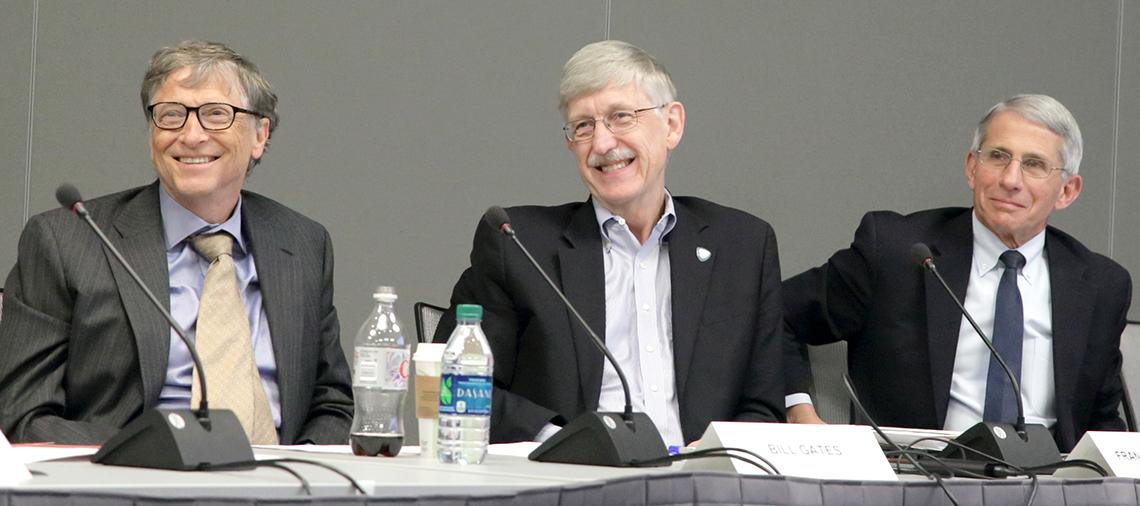 Gates, Collins and Fauci seated at a panel table