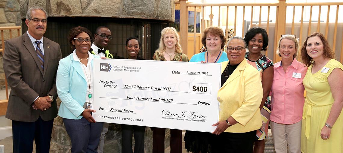 Frasier presents a large check to the inn