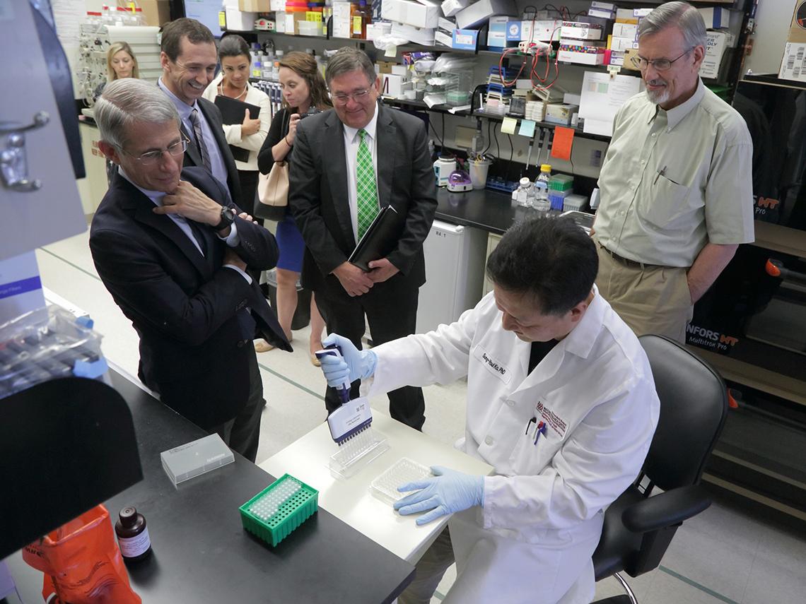 Rep. Burgess with scientists in the lab