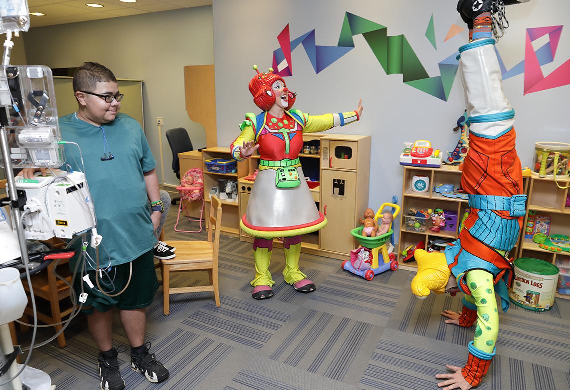 Glenn smiles at clown antics.