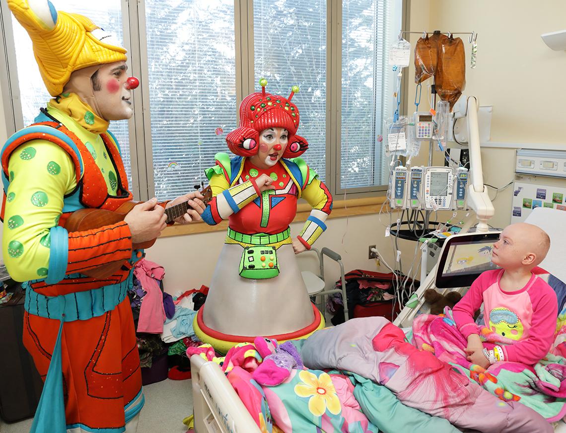 Circus clowns treat Ponzar to an impromptu concert. 